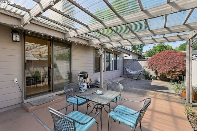 12604 NE Prescott Dr, Portland, OR 97230 - view of patio / terrace featuring outdoor dining space, a pergola, and fence