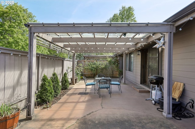12604 NE Prescott Dr, Portland, OR 97230 - view of patio with outdoor dining space, a pergola, a fenced backyard, and a grill