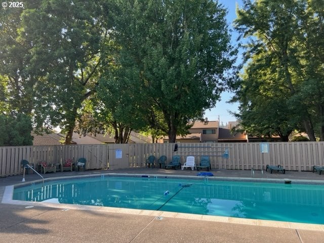 12604 NE Prescott Dr, Portland, OR 97230 - community pool featuring fence and a patio area