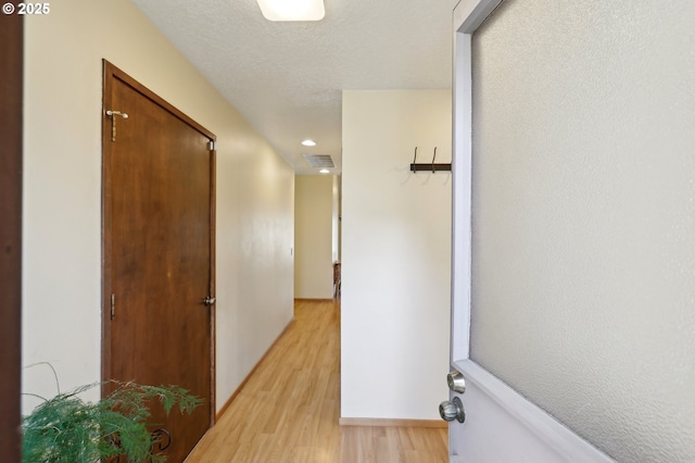 12604 NE Prescott Dr, Portland, OR 97230 - hall featuring light wood-style flooring, recessed lighting, and baseboards