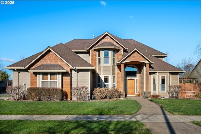 craftsman-style home featuring a front yard