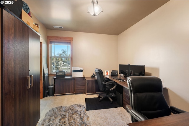 home office with light carpet and visible vents