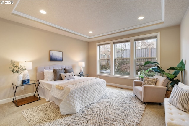 carpeted bedroom with a raised ceiling, crown molding, and a textured ceiling