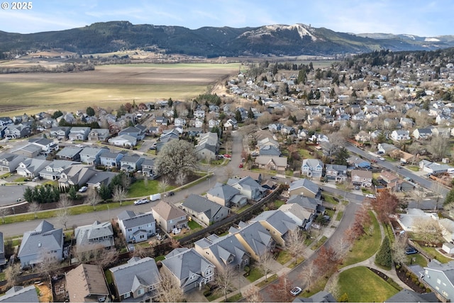 birds eye view of property with a mountain view