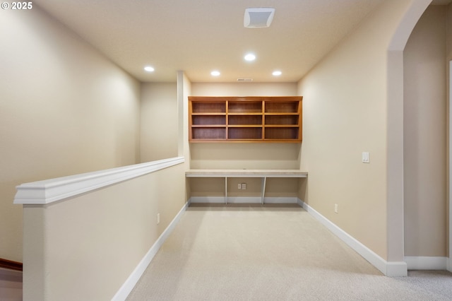 hallway featuring carpet flooring