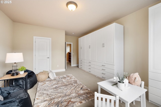 bedroom featuring light colored carpet