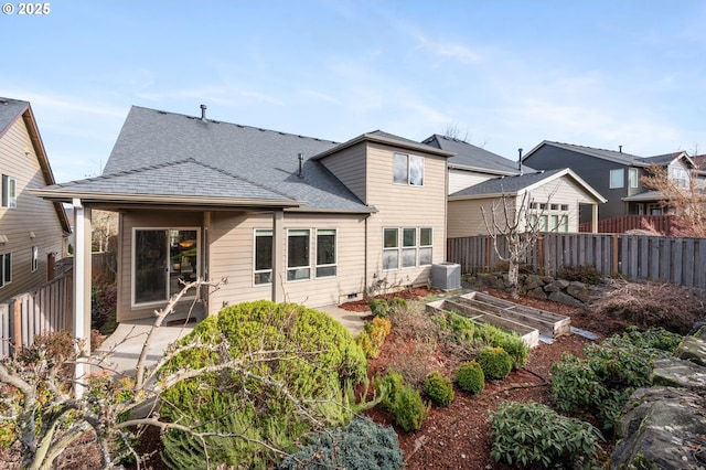 rear view of house with a patio and central air condition unit