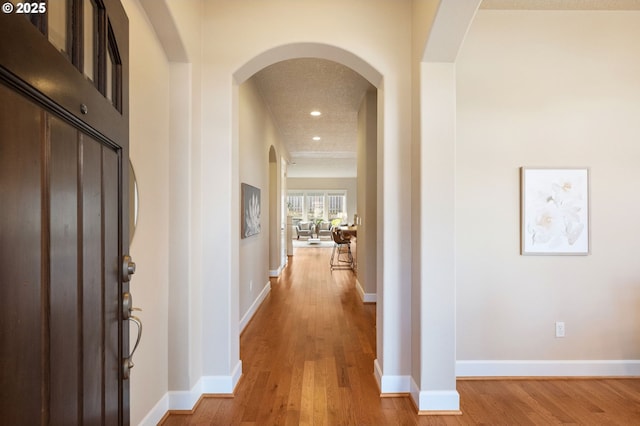 corridor featuring light hardwood / wood-style floors