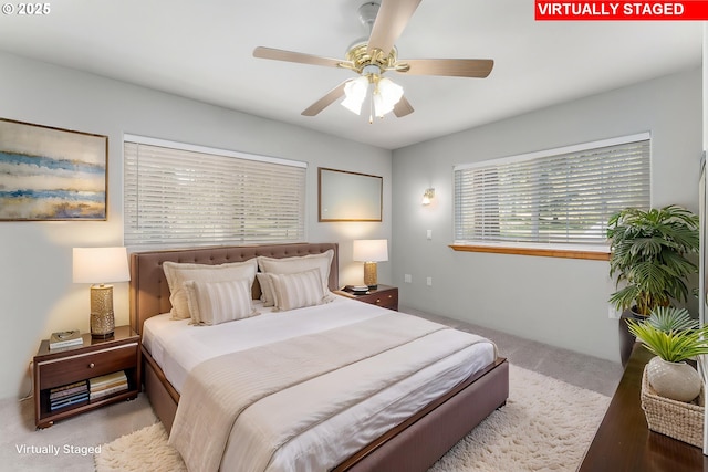 bedroom with carpet flooring and a ceiling fan