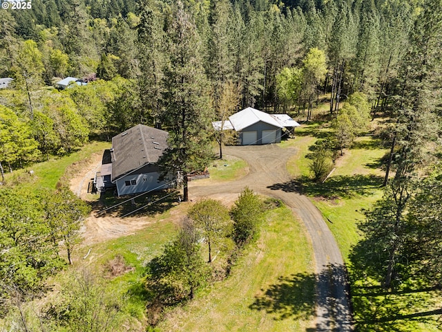 drone / aerial view featuring a view of trees