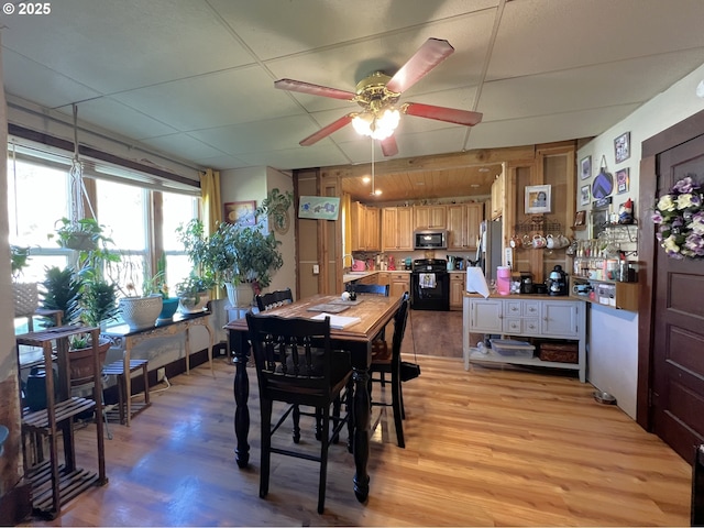 dining room featuring light wood-type flooring and ceiling fan