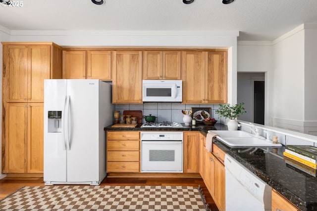 884 NE 73rd Ave, Hillsboro, OR 97124 - kitchen with white appliances, wood finished floors, and decorative backsplash