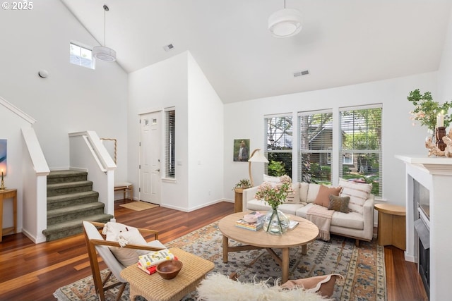 884 NE 73rd Ave, Hillsboro, OR 97124 - living area featuring a fireplace, stairs, healthy amount of natural light, wood finished floors, and high vaulted ceiling