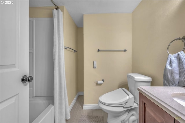 full bathroom with vanity, shower / bath combo, and toilet