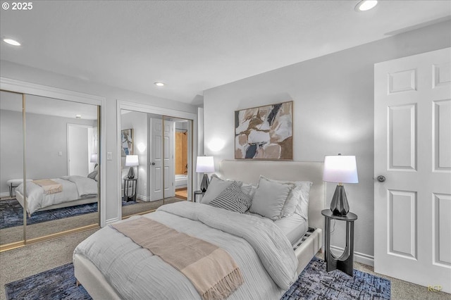 carpeted bedroom with multiple closets