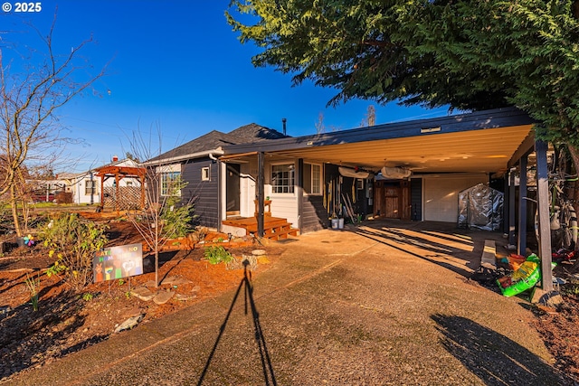 view of front of home featuring a garage and a carport