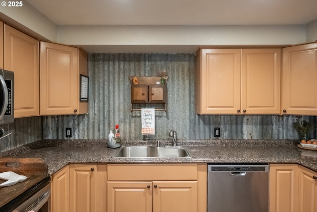 kitchen with dishwasher, sink, and light brown cabinets