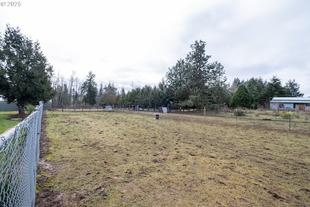 view of yard with a rural view