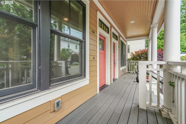 wooden terrace with a porch