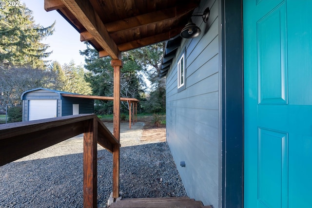 exterior space with an outbuilding and a garage