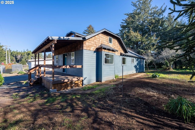 view of property exterior featuring a wooden deck