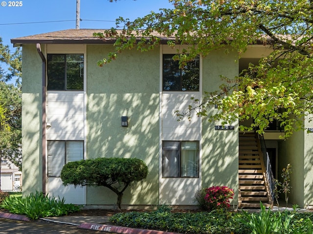 3329 NE 162nd Ave, Portland, OR 97230 - view of home's exterior featuring stairway and stucco siding