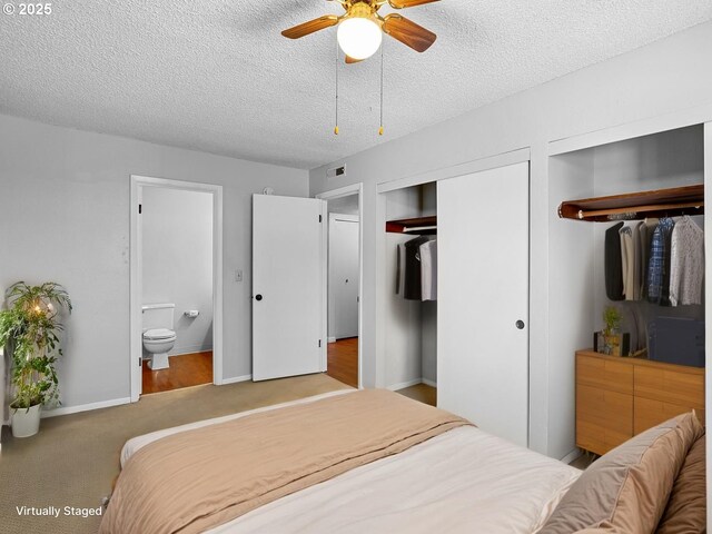 3329 NE 162nd Ave, Portland, OR 97230 - carpeted bedroom featuring two closets, a textured ceiling, ensuite bath, and a ceiling fan