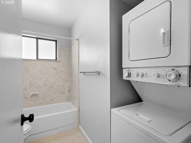 3329 NE 162nd Ave, Portland, OR 97230 - bathroom featuring stacked washer and clothes dryer,  shower combination, and tile patterned floors
