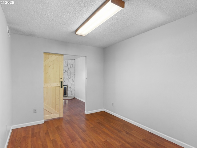 3329 NE 162nd Ave, Portland, OR 97230 - spare room featuring wood finished floors and a textured ceiling