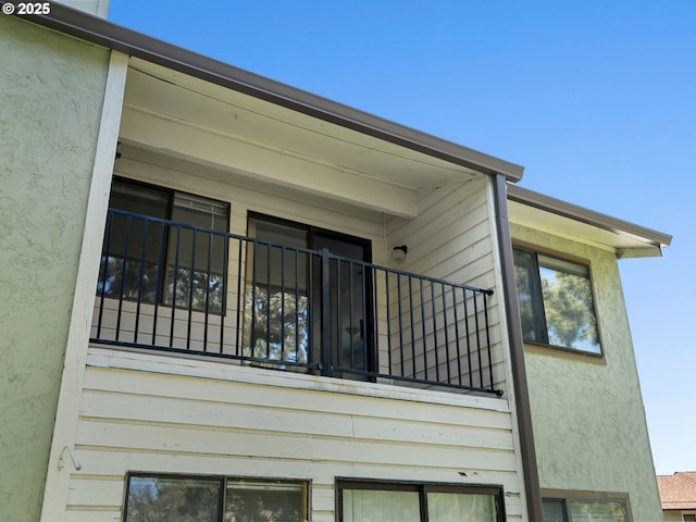 3329 NE 162nd Ave, Portland, OR 97230 - view of side of home featuring stucco siding and a balcony