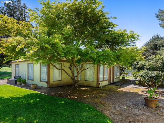 3329 NE 162nd Ave, Portland, OR 97230 - view of property exterior with a lawn and stucco siding