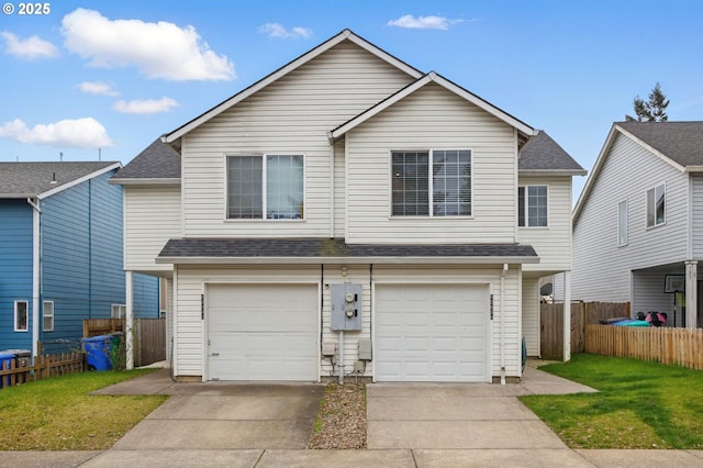 view of front of home featuring an attached garage, fence, roof with shingles, a front yard, and driveway