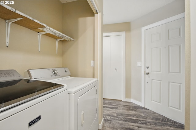 washroom with laundry area, wood finished floors, and independent washer and dryer