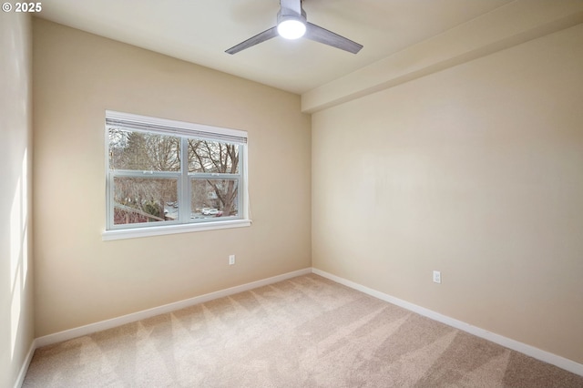 unfurnished room with carpet and ceiling fan