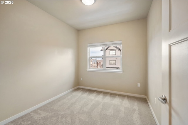 empty room featuring light colored carpet