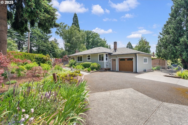 3606 SE Johnson Creek Blvd, Portland, OR 97222 - ranch-style home featuring asphalt driveway, a chimney, and an attached garage