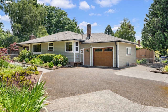 3606 SE Johnson Creek Blvd, Portland, OR 97222 - single story home with a chimney, an attached garage, and asphalt driveway