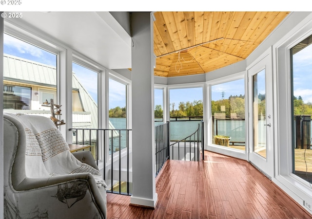 7720 SW Macadam Ave Unit 9, Portland, OR 97219 - sunroom with wood ceiling, hardwood / wood-style floors, and a water view