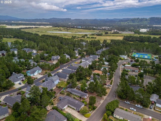 1629 N Siano Loop, Florence, OR 97439 - aerial view of property and surrounding area with nearby suburban area and a water and mountain view