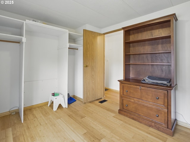 1629 N Siano Loop, Florence, OR 97439 - walk in closet with light wood finished floors