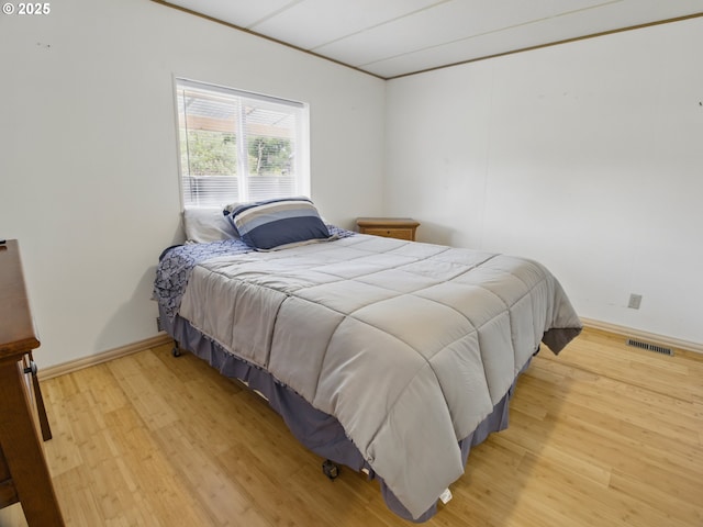 1629 N Siano Loop, Florence, OR 97439 - bedroom with light wood-type flooring and baseboards