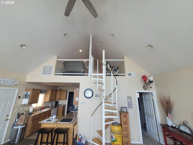 18699 NE Marine Dr Unit C-7, Gresham, OR 97230 - living area featuring stairs, high vaulted ceiling, a ceiling fan, and recessed lighting