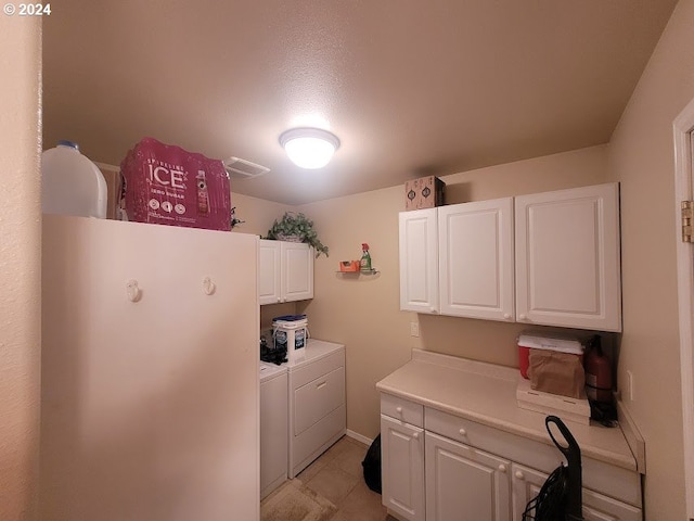 18699 NE Marine Dr Unit C-7, Gresham, OR 97230 - washroom featuring cabinet space, washing machine and clothes dryer, and light tile patterned floors