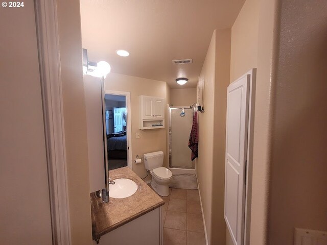 18699 NE Marine Dr Unit C-7, Gresham, OR 97230 - full bath with toilet, tile patterned floors, vanity, shower / bath combination with glass door, and ensuite bath