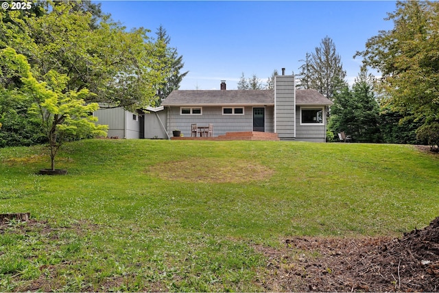 92757 Claremont Rd, Astoria, OR 97103 - rear view of property featuring a chimney and a lawn