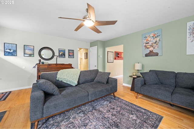 92757 Claremont Rd, Astoria, OR 97103 - living room featuring ceiling fan, wood finished floors, and baseboards