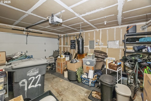 garage with electric panel and a garage door opener