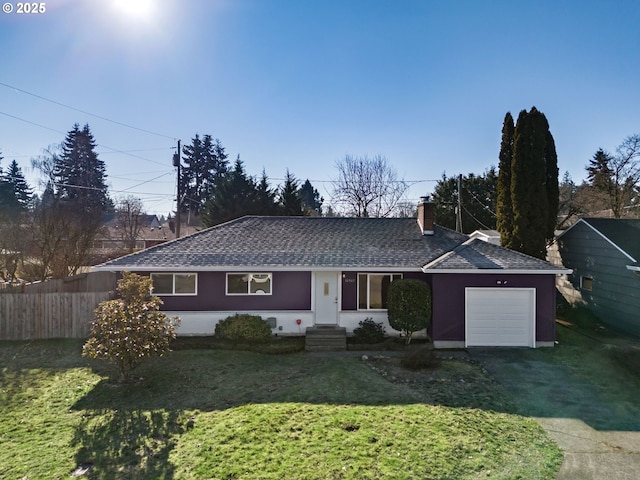 single story home featuring a garage and a front lawn