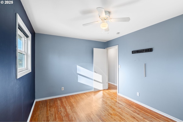 unfurnished room featuring ceiling fan and light hardwood / wood-style floors