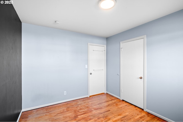 unfurnished bedroom with light hardwood / wood-style floors